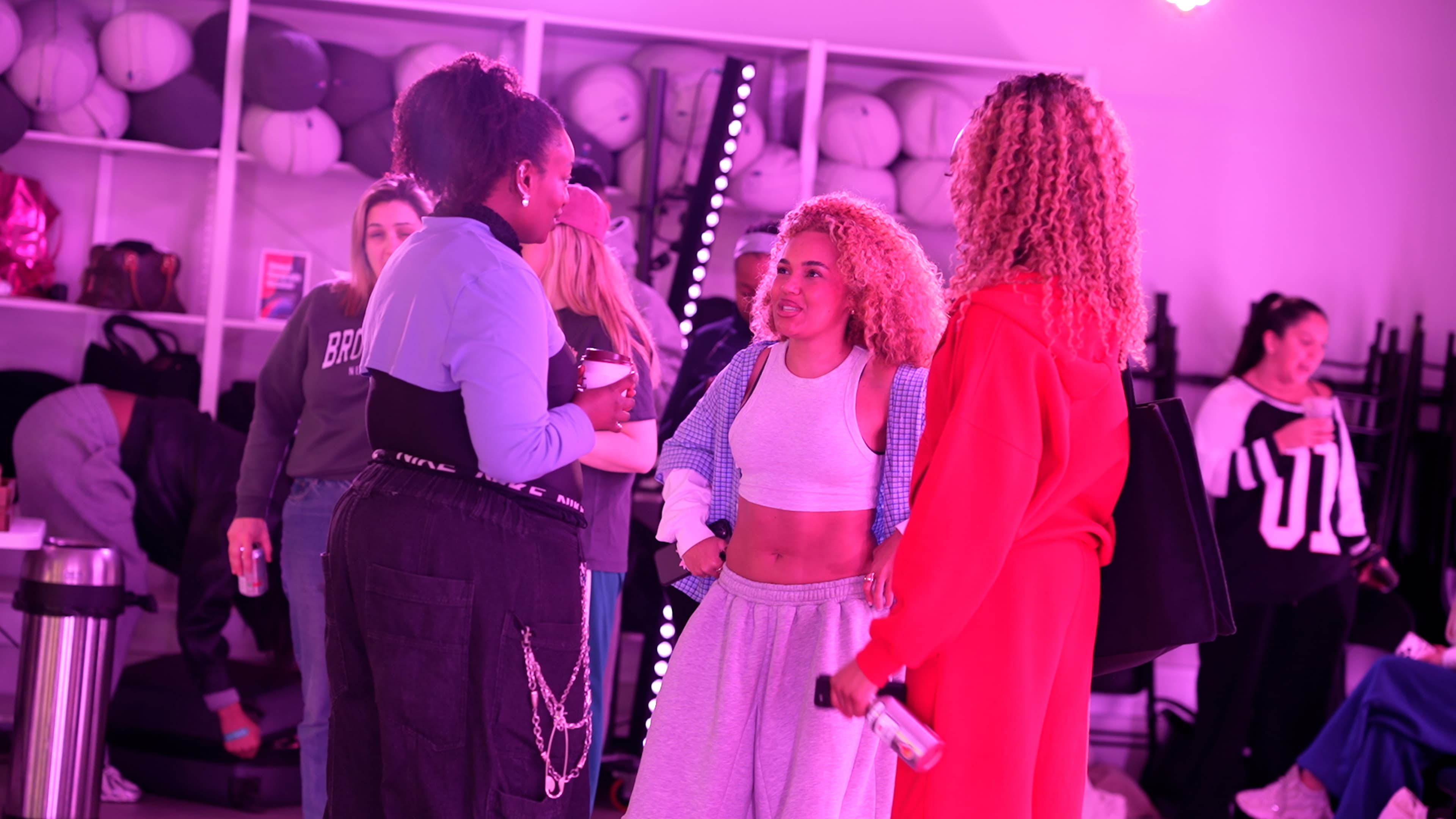 YouTube Creator Collective event at The Manor LDN, with creators taking part in a branded dance workshop and social experience under vibrant pink and purple lighting, alongside group moments and YouTube-branded event details.