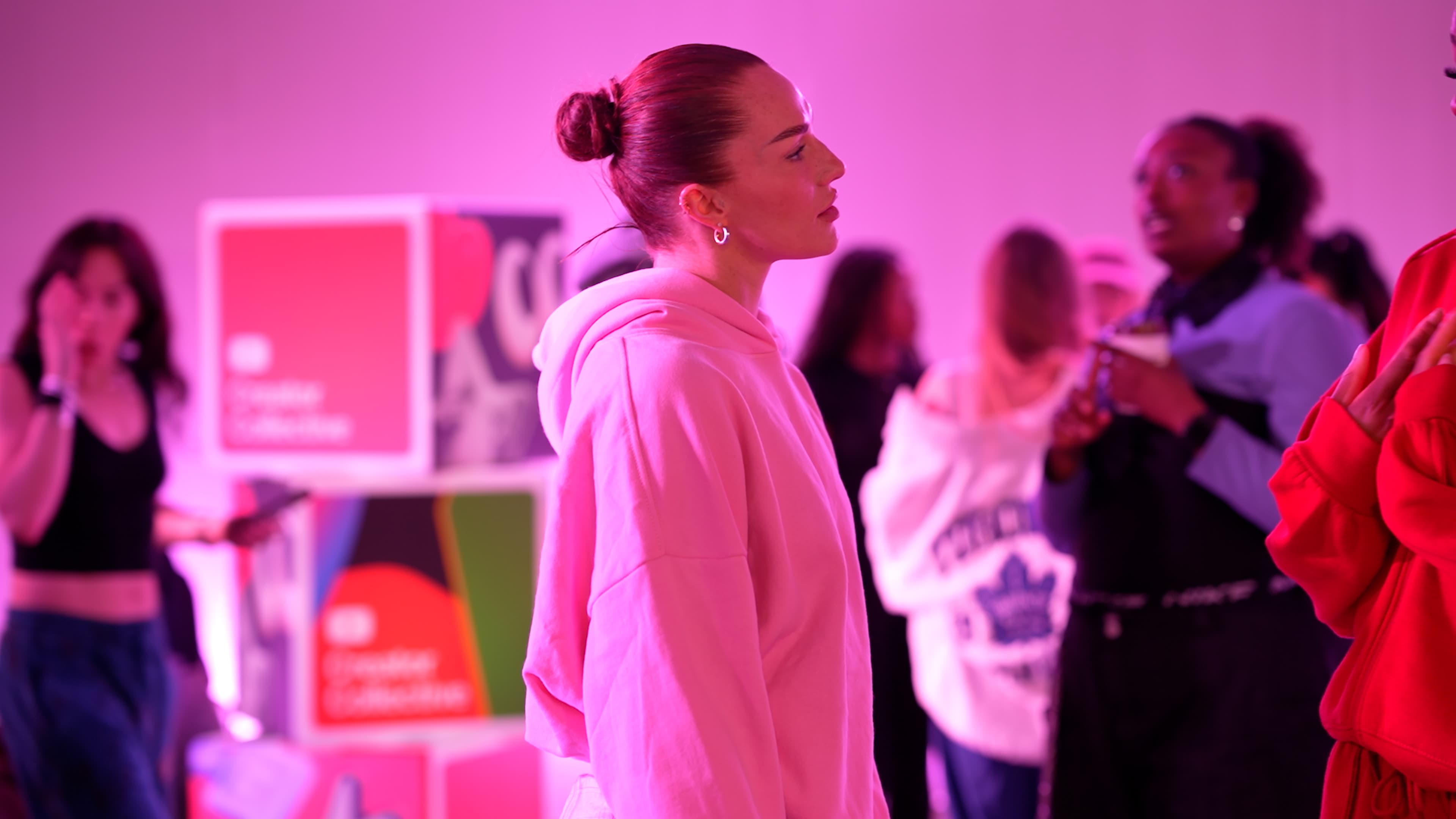 YouTube Creator Collective event at The Manor LDN, with creators taking part in a branded dance workshop and social experience under vibrant pink and purple lighting, alongside group moments and YouTube-branded event details.